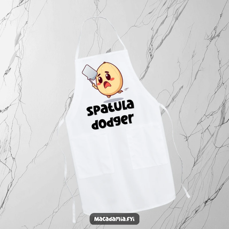 Funny Macadamia Nut Apron showing a shocked nut making a hasty retreat from an incoming spatula.