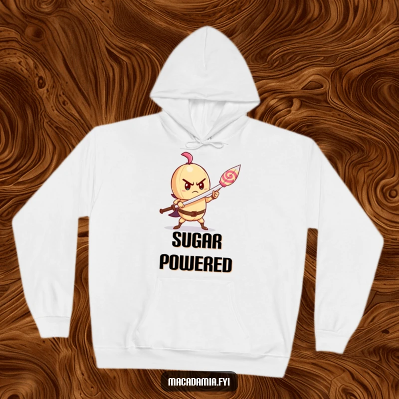 Funny macadamia nut hoodie showing a determined character bravely wielding a lollipop like a sword, offering cozy inspiration.