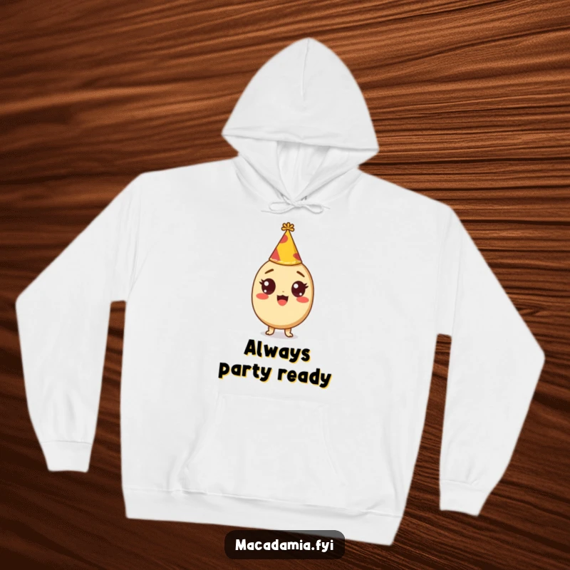 Funny hoodie featuring a macadamia nut character with wide, excited eyes wearing a tiny party hat, perfect for festive occasions.