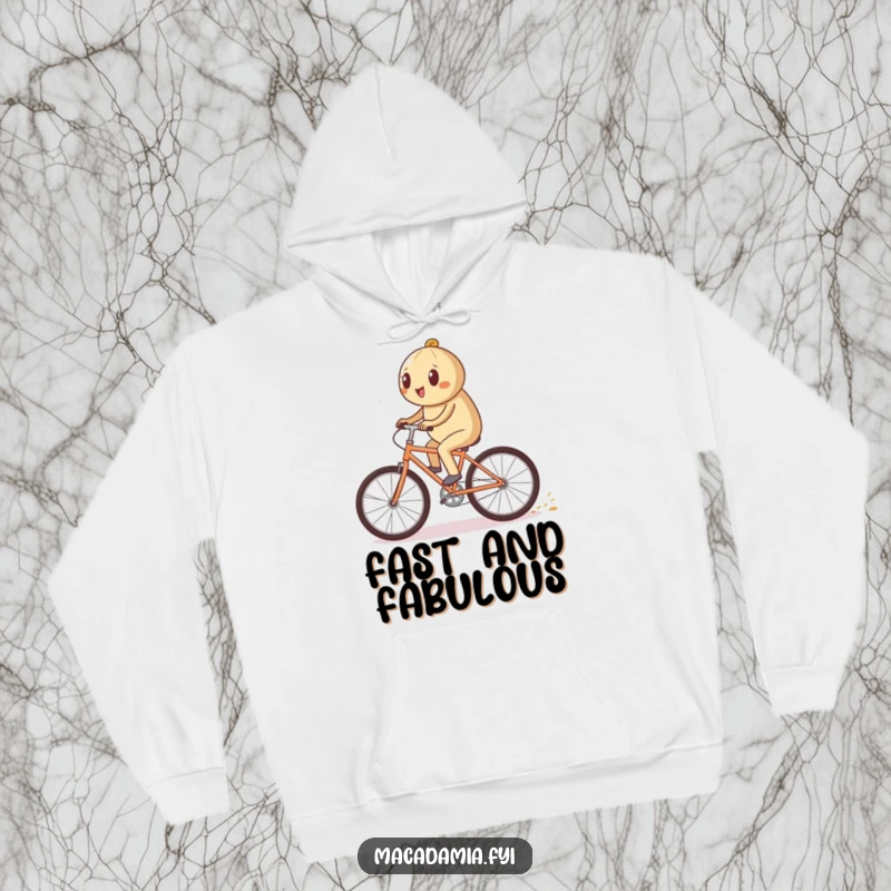 Funny macadamia nut character riding a bicycle quickly on a cozy hoodie, leaving a sparkling trail, a magical funny gift.