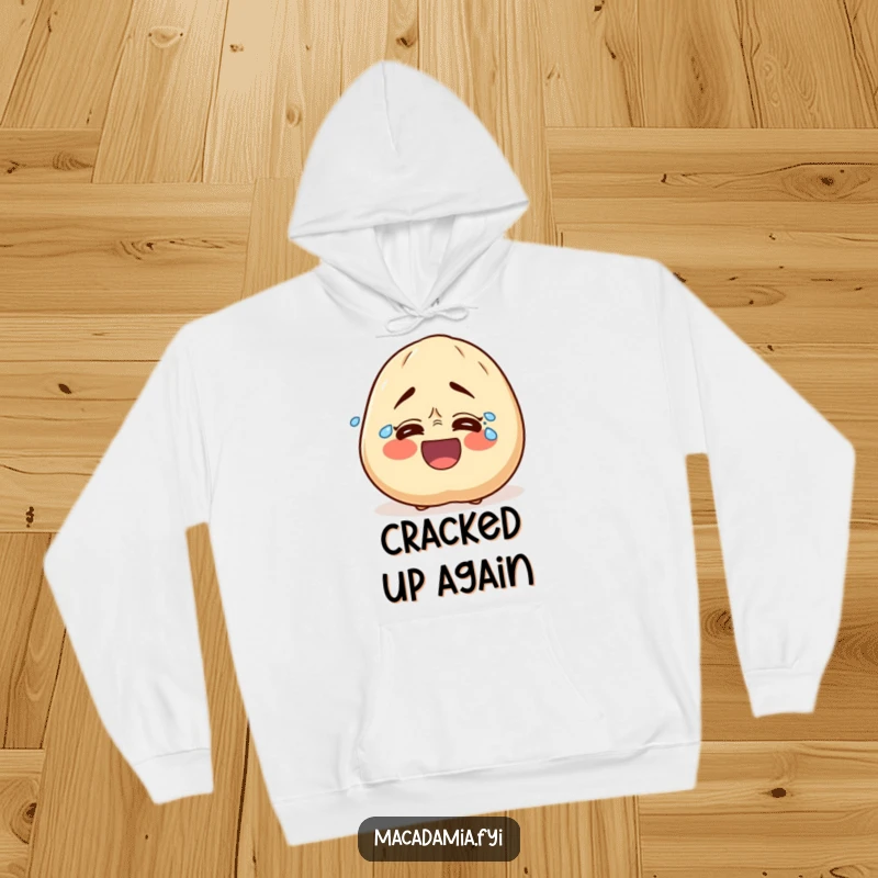 Funny hoodie showcasing a macadamia nut character bursting with uncontrollable laughter, tears streaming down its face in pure comedic bliss.