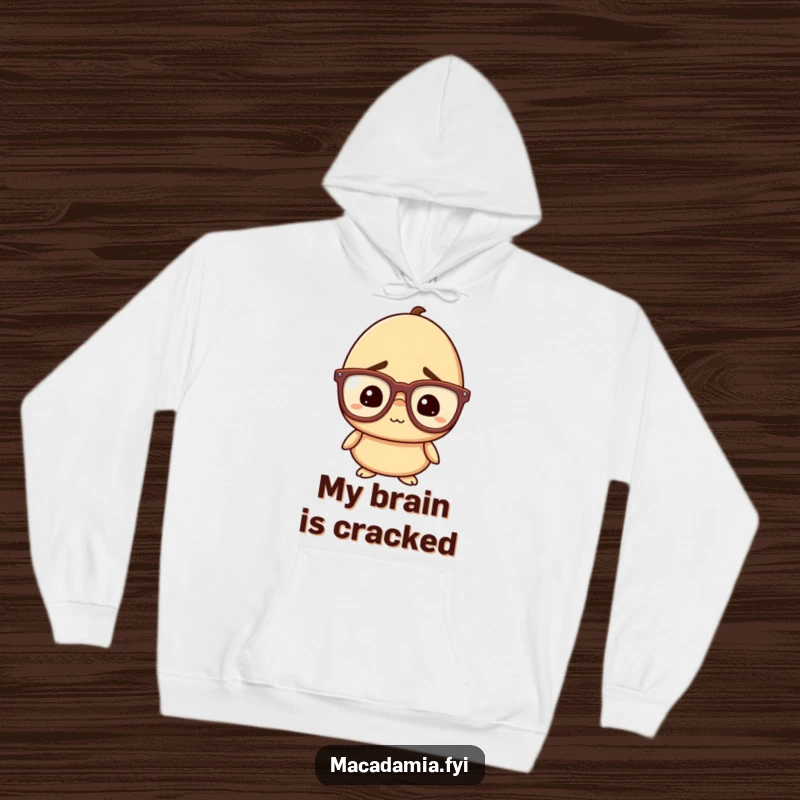 Funny Nut Hoodie: A macadamia nut character with oversized glasses looks confused but amused, offering a cozy and humorous experience.