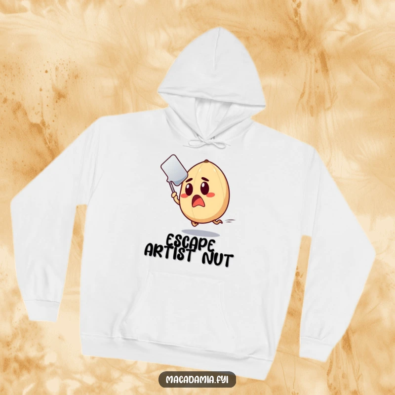 Funny Macadamia Nut Hoodie capturing a surprised nut making a speedy escape from a flying spatula.