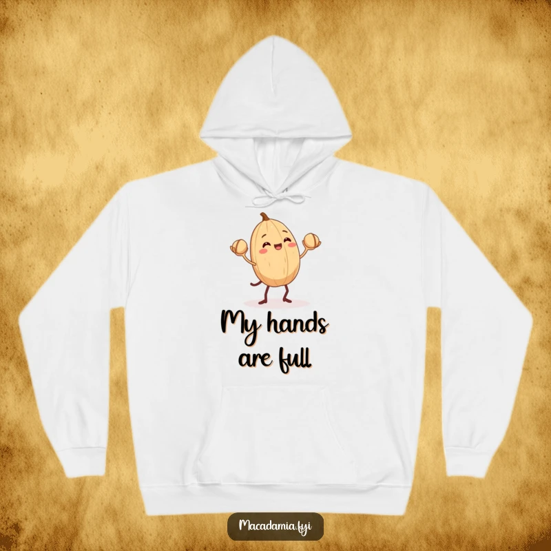 Funny Macadamia Nut Hoodie: A macadamia nut with tiny legs juggling smaller nuts, a humorous and warm apparel choice.