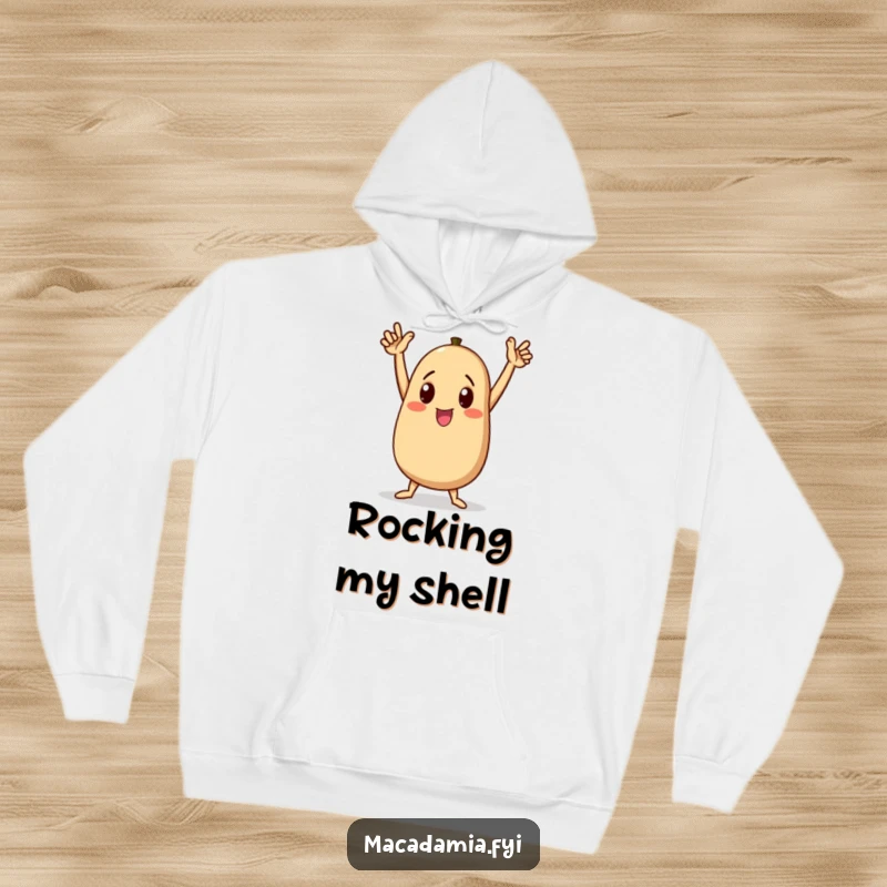 Funny macadamia nut character doing a triumphant dance on a cozy hoodie, arms raised high in celebration, a great funny gift.