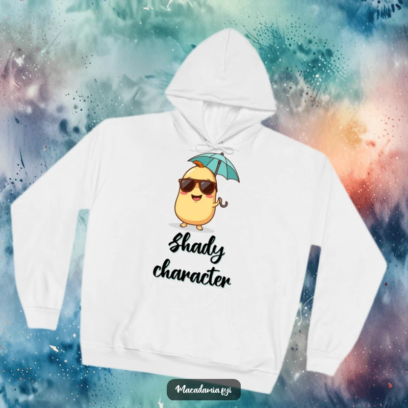 Funny, soft hoodie of a giggling macadamia nut character wearing sunglasses and holding a tiny umbrella, embodying tropical fun.