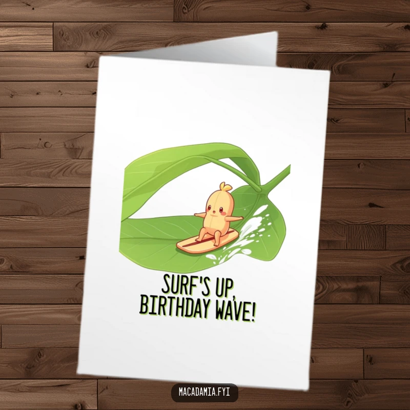 Funny Free Printable Birthday Card: A macadamia nut character joyfully surfing on a large green leaf, enjoying a breezy ride.