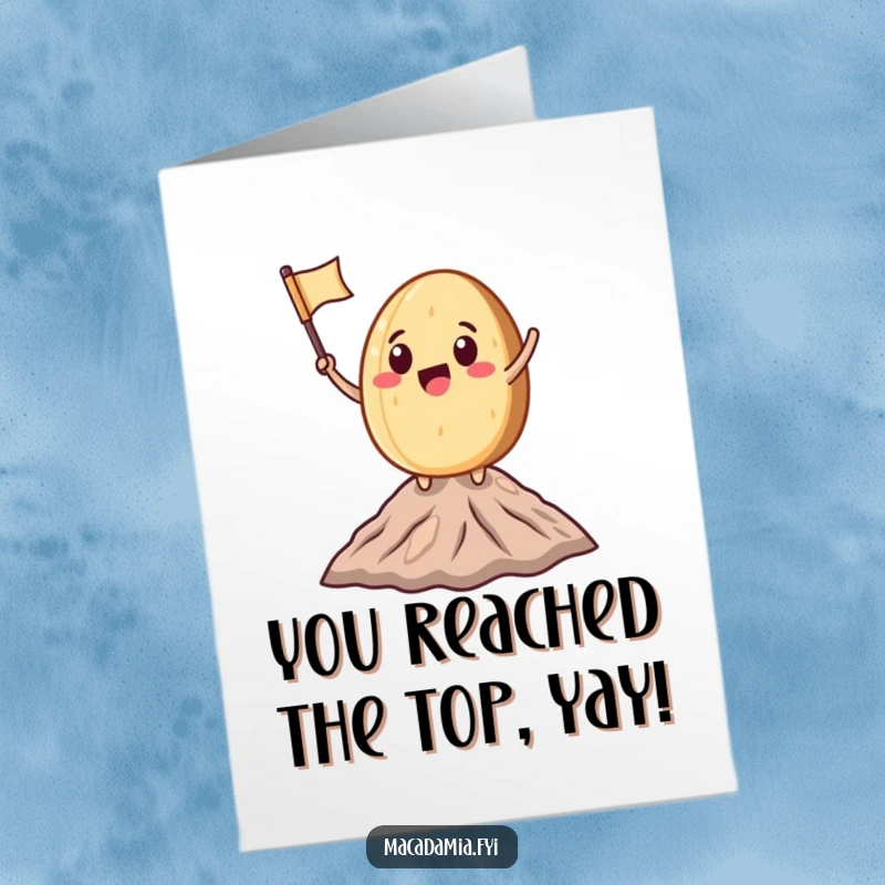 Funny Free Printable Congratulations Card: A macadamia nut character triumphantly waves a small flag atop a miniature mountain peak, signifying victory.